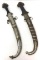 Pair of Curved Middle Eastern Daggers with Highly Decorated Scabbards