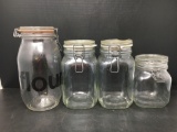 4 Glass Storage Jars with Wire Closures- One Marked 