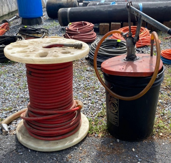 Spool of Hose and Oil Can