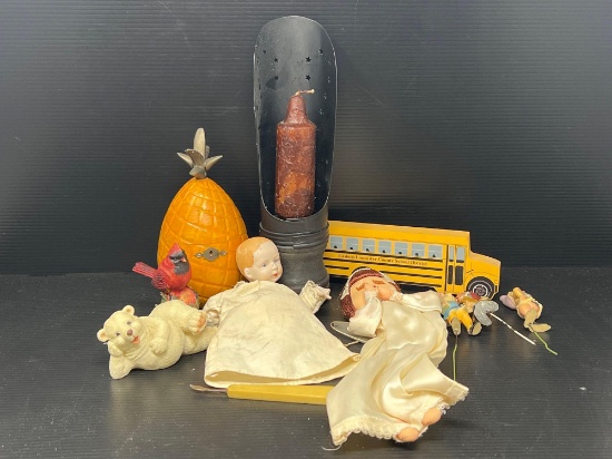 2 Dolls, Tin Candle Holder with Candle, Bus Cut-Out, Bear Figure and Pineapple "Box"