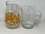 2 Glass Pitchers- One Has Floral Design
