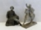 2 White Metal Figures- Seated Man with Sword and Man in Hat on Horseback