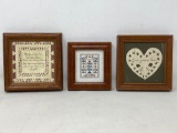 Three framed hand-crafted wall hangings