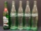 4 Coca-Cola Bottles, 7-Up Bottles
