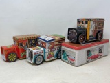 4 Decorative Tins- 3 are Trucks and 1 is Building