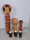 3 Wooden Asian Dolls and 3 Wooden Painted Face Egg Cups