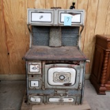 ANTIQUE STOVE WITH PORCELAIN INSERTS