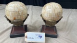 STONE SPHERES WITH WOOD AND BRONZE BASES