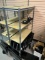 Metal rack with shelves Approximately 5 feet tall. Rack only.