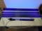 Fluorescent lights with black light bulbs Turned on in photo