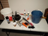 Caulk and caulk guns, zip ties, buckets, wasp spray