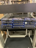 ProSafe 8 Port Gigabit Switch Thirteen 8 port network switches with cords included. One not pictured