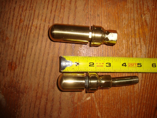 Pair of two small brass whistles