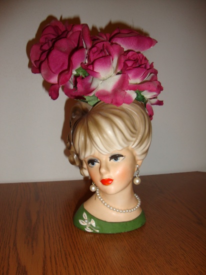 Woman head vase with earrings