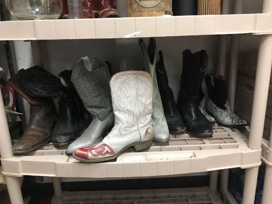 Shelf of assorted cowboy/cowgirl boots