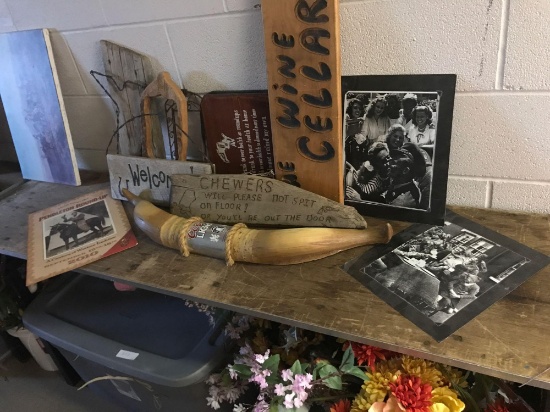 Assortment of western themed signs and military photographs
