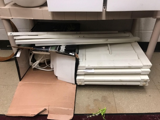 Shelf of white shutters and umbrella lights