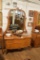 Golden Oak Serpentine Front Dresser With Beveled Mirror