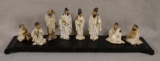 8 Chinese Figures on Wood Stand. Glazed White Robes. Modern. Largest is 5
