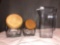 (2) Glass Sugar Jars w/ Wood Lids & (1) Plastic Carafe.