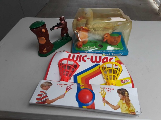 Novelty coin bank, outside kids toy, and duck family lawn decoration, and 2 american flags