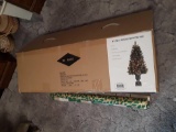 Fake christmas tree in box with rapping paper