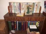 Assorted books on shelf and in box