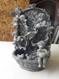 Electronic water fountain with cherubs
