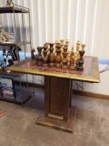 Wooden Chess Table w/ Glass Top & Needlepoint Chess Board Under Glass.