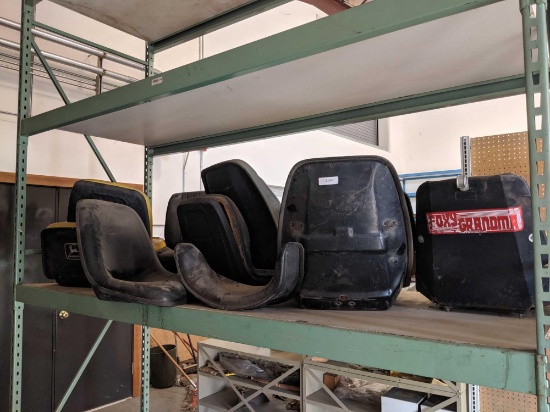 Shelf of John Deer Tractor Seats - Various Conditions