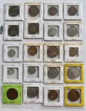 Lot of over 100 foreign coins in notebook