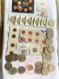 Mixed lot of coins including 16 clad Eisenhower Dollars and 9 clad Kennedy half dollar
