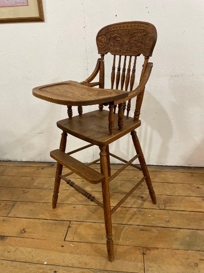 Ornately Carved Spindle Back Oak High Chair