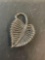 Sterling pin in shape of a leaf.