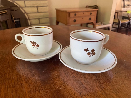 Pair Of Royal Ironstone Tea Leaf cups & saucers