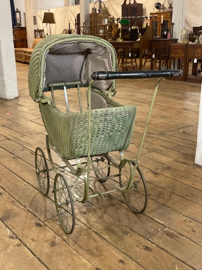 Antique green doll buggy