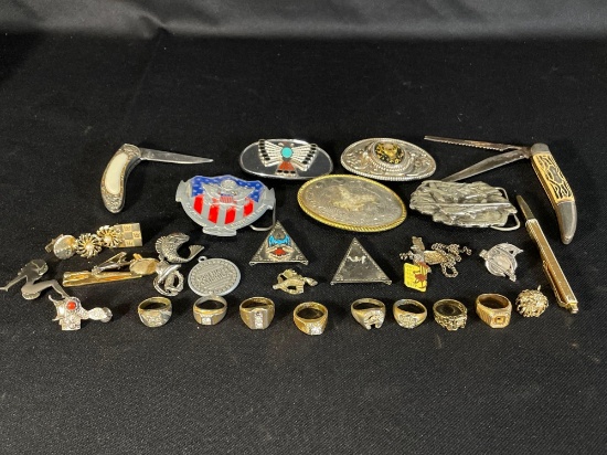 Assortment Of Belt buckles, Costume Jewelry Rings & (2) Pocket Knifes