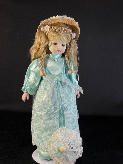 17" Porcelain doll in a blue rose dress w/ stand & sun hat
