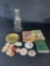 Assortment milk caps, pin buttons, books -see photo's-