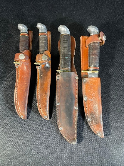 (4) Western fixed hunting knives w/ sheath's