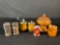 salt and pepper shakers, along with a toothpick holder and a small container with a lid.