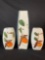three hand-painted Japanese porcelain vases. The vases are decorated with a stylized persimmon fr...