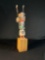 Hopi Kachina doll, also known as a Katsina doll, which is a carved figure representing a spirit
