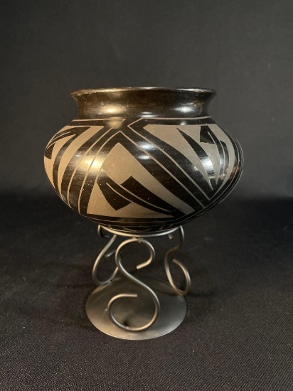 Mata Ortiz blackware pottery bowl on a metal stand Signed Tavo Silveira