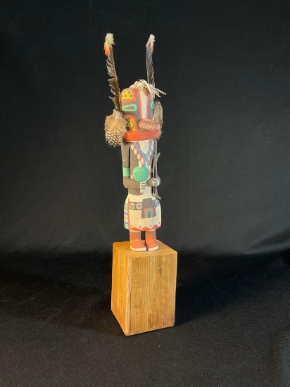 Hopi Kachina doll, also known as a Katsina doll, which is a carved figure representing a spirit