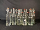 (22) Clear, Green & Brown glass bottles with swing-top closures