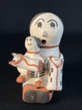 Acoma Pottery storyteller figurine featuring a mother and two babies Navajo ,R Chacho