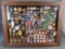 Framed collection of over 100 old badges, political buttons etc