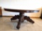 Massive, heavily carved oak dinning table with leaves