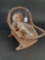 Wicker cradle with bisque doll, compo body